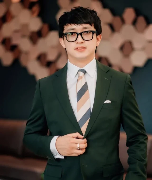 Mark Anthony N. Tan in a dark green suit